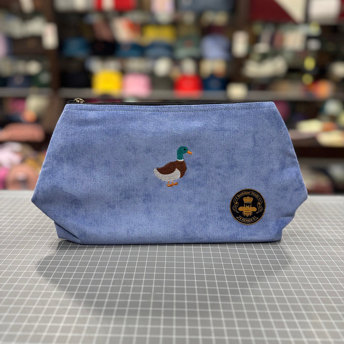 The Duck 🦆🪡 on Sky Blue Corduroy Large Toiletry + Makeup Bag